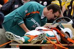 MIAMI - JANUARY 03:  Quarterback Pat White #6 of the Miami Dolphins is carted off the field after being knocked unconcious in the third quarter against the Pittsburgh Steelers at Land Shark Stadium on January 3, 2010 in Miami, Florida. The Steelers defeated the Dolphins 30-24.  (Photo by Doug Benc/Getty Images)