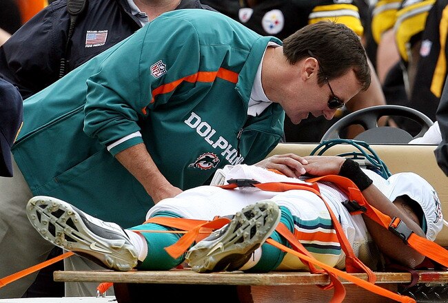 MIAMI - JANUARY 03:  Quarterback Pat White #6 of the Miami Dolphins is carted off the field after being knocked unconcious in the third quarter against the Pittsburgh Steelers at Land Shark Stadium on January 3, 2010 in Miami, Florida. The Steelers defeated the Dolphins 30-24.  (Photo by Doug Benc/Getty Images)