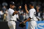 NEW YORK - APRIL 13:  Derek Jeter #2 and Mariano Rivera #42 of the New York Yankees celebrate after defeating the Los Angeles Angels of Anaheim during the Yankees home opener at Yankee Stadium on April 13, 2010 in the Bronx borough of New York City.  (Photo by Chris Trotman/Getty Images)