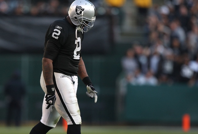 OAKLAND, CA - JANUARY 03:  JaMarcus Russell #2 of the Oakland Raiders walks off the field against the Baltimore Ravens during an NFL game at Oakland-Alameda County Coliseum on January 3, 2010 in Oakland, California.  (Photo by Jed Jacobsohn/Getty Images)