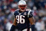 FOXBORO, MA - JANUARY 10:  Adalius Thomas #96 of the New England Patriots looks on against the Baltimore Ravens during the 2010 AFC wild-card playoff game at Gillette Stadium on January 10, 2010 in Foxboro, Massachusetts. The Ravens won 33-14. (Photo by Elsa/Getty Images)