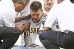 HOUSTON - APRIL 24:  Pitcher Chris Jakubauskas #39 of the Pittsburgh Pirates is treated by team trainers after being hit in the face with a line drive off the bat of Lance Berkman of the Houston Astros in the first inning at Minute Maid Park on April 24, 2010 in Houston, Texas.  (Photo by Bob Levey/Getty Images)