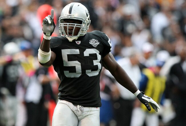 OAKLAND, CA - OCTOBER 18:  Thomas Howard #53 of the Oakland Raiders celebrates after a play against the Philadelphia Eagles during an NFL game at the Oakland-Alameda County Coliseum on October 18, 2009 in Oakland, California.  (Photo by Jed Jacobsohn/Getty Images)