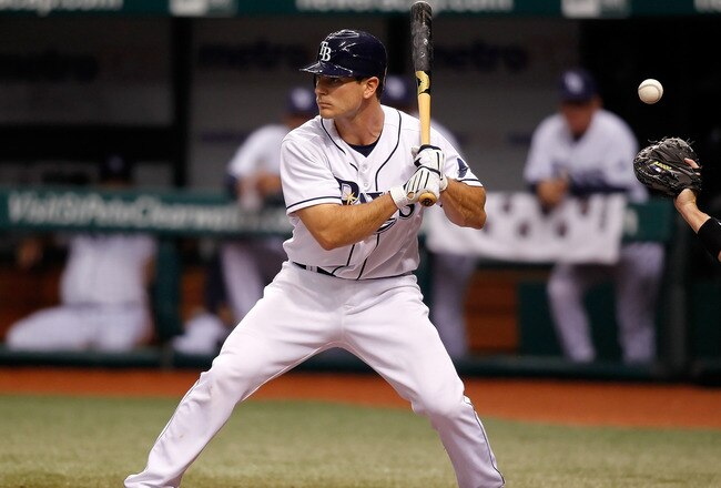 ST. PETERSBURG - APRIL 24:  Catcher John Jaso #28 of the Tampa Bay Rays takes a pitch against the Toronto Blue Jays during the game at Tropicana Field on April 24, 2010 in St. Petersburg, Florida.  (Photo by J. Meric/Getty Images)