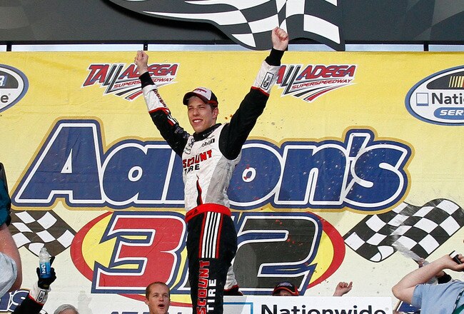 TALLADEGA, AL - APRIL 25:  Brad Keselowski, driver of the #22 Discount Tire Dodge, celebrates in Victory Lane after winning the NASCAR Nationwide Series Aaron's 312 at Talladega Superspeedway on April 25, 2010 in Talladega, Alabama.  (Photo by Jason Smith/Getty Images)