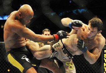 PHILADELPHIA - AUGUST 08: (L-R) Anderson Silva battles Forrest Griffin during their light heavyweight bout at UFC 101: Declaration at the Wachovia Center on August 8, 2009 in Philadelphia, Pennsylvania. (Photo by Jon Kopaloff/Getty Images)