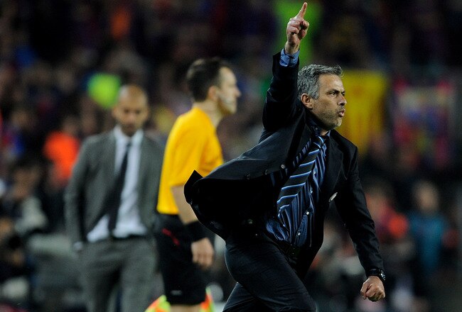 BARCELONA, SPAIN - APRIL 28: Inter Milan manager Jose Mourinho celebrates victory as barcelona manager Josep Guardiola looks on during the UEFA Champions League Semi Final Second Leg match between Barcelona and Inter Milan at Camp Nou on April 28, 2010 in Barcelona, Spain.  (Photo by Michael Regan/Getty Images)