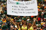 GREEN BAY, WI - DECEMBER 27: Fans of the Green Bay Packers hold a sign and wear bikini's in below freezing weather during a game between the Packers and the Seattle Seahawks at Lambeau Field on December 27, 2009 in Green Bay, Wisconsin. The Packers defeated the Seahawks 48-10. (Photo by Jonathan Daniel/Getty Images)
