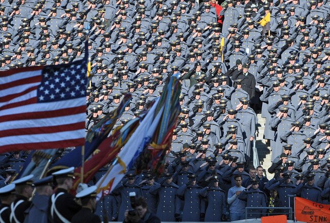 PHILADELPHIA - DECEMBER 12:  Army Cadets salute the American Flag during the National Anthem before the game against the Navy Midshipmen on December 12, 2009 at Lincoln Financial Field in Philadelphia, Pennsylvania. (Photo by Drew Hallowell/Getty Images)