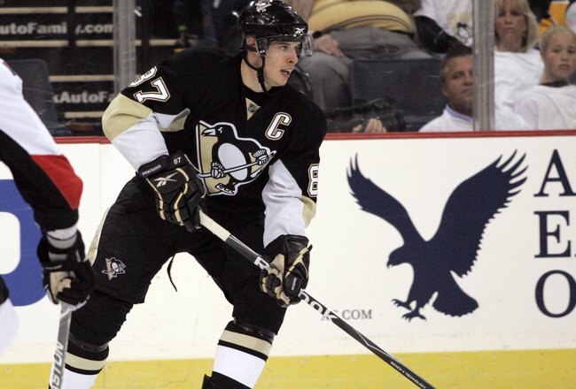 PITTSBURGH - APRIL 22:  Sidney Crosby #87 of the Pittsburgh Penguins looks to make a pass against the Ottawa Senators in Game Five of the Eastern Conference Quarterfinals during the 2010 NHL Stanley Cup Playoffs at Mellon Arena on April 22, 2010 in Pittsburgh, Pennsylvania.  The Senators defeated the Penguins 4-3 in triple overtime.  (Photo by Justin K. Aller/Getty Images)