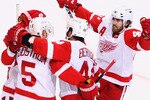 GLENDALE, AZ - APRIL 27:  Henrik Zetterberg #40 of the Detroit Red Wings celebrates with teammates after Nicklas Lidstrom #5 scored a second period goal against the Phoenix Coyotes in Game Seven of the Western Conference Quarterfinals during the 2010 NHL Stanley Cup Playoffs at Jobing.com Arena on April 27, 2010 in Glendale, Arizona. The Red Wings defeated the Coyotes 6-1 to win the series 4-3. (Photo by Christian Petersen/Getty Images)