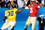 JACKSONVILLE, FL - JANUARY 01:  Quarterback E.J. Manuel #3 of the Florida State Seminoles avoids a sack by linebacker J.T. Thomas #30 of the West Virginia Mountaineers before completing a pass during the Konica Minolta Gator Bowl on January 1, 2010 at Jacksonville Municipal Stadium in Jacksonville, Florida. Florida State defeated West Virginia 33-21 in Bobby Bowden's last game as a head coach for the Seminoles.  (Photo by Doug Benc/Getty Images)