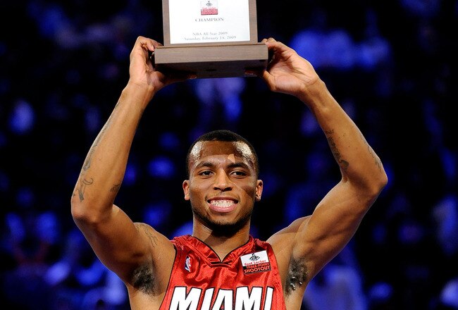 PHOENIX - FEBRUARY 14:  Daequan Cook of the Miami Heat holds up the trophy after winning the Foot Locker Three-Point Shootout on All-Star Saturday Night, part of 2009 NBA All-Star Weekend at US Airways Center on February 14, 2009 in Phoenix, Arizona.  NOTE TO USER: User expressly acknowledges and agrees that, by downloading and or using this photograph, User is consenting to the terms and conditions of the Getty Images License Agreement.  (Photo by Kevork Djansezian/Getty Images)