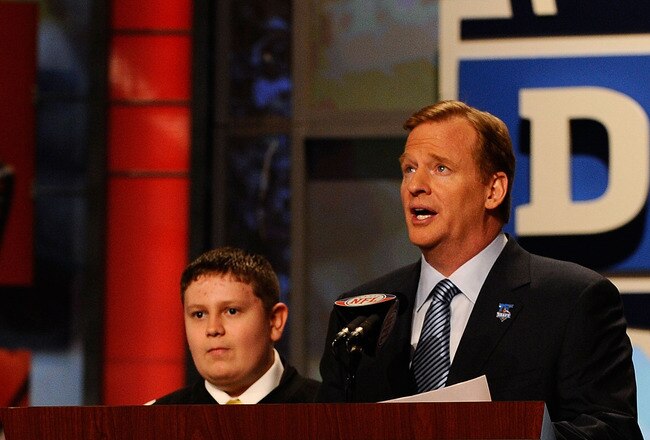 NEW YORK - APRIL 22:  NFL Commissioner Roger Goodell introduces 16-year old Zachary Hatfield (L) from Florence, KY, Hatfield then made the announcement that Maurkice Pouncey from the Florida Gators was selected by the Pittsburgh Steelers number 18 overall during the first round of the 2010 NFL Draft at Radio City Music Hall on April 22, 2010 in New York City. Hatfield was able to make the draft pick annopncement through the efforts of the Make-A-Wish Foundation.  (Photo by Jeff Zelevansky/Getty Images)