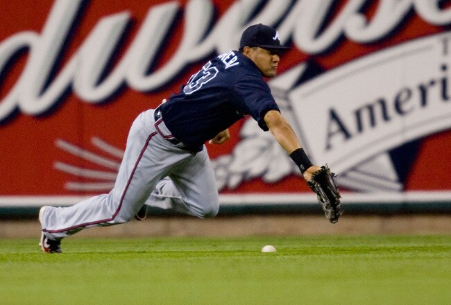 ST. LOUIS - APRIL 27: Melky Cabrera #53 of the Atlanta Brave misplays a fly ball against the St. Louis Cardinals at Busch Stadium on April 27, 2010 in St. Louis, Missouri.  The Cardinals beat the Braves 5-4.  (Photo by Dilip Vishwanat/Getty Images)
