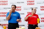 LAS VEGAS - OCTOBER 20:  Vinny Red (R) and Vinny Blue compete in a Nathan's hot dog eating challenge as they launch New York-New York Hotel & Casino's search for the ultimate spokesperson, Vinny 'The Man' October 20, 2009 in Las Vegas, Nevada. The ultimate 'Vinny', determined by the public vote, will have the most New York swagger and be crowned the resort's new spokesperson.  (Photo by Isaac Brekken/Getty Images for New York-New York)