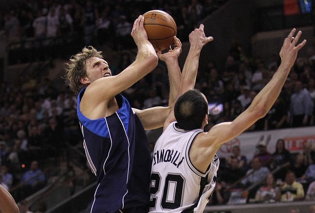 SAN ANTONIO - APRIL 29:  Forward Dirk Nowitzki #41 of the Dallas Mavericks takes a shot against Manu Ginobili #20 of the San Antonio Spurs in Game Six of the Western Conference Quarterfinals during the 2010 NBA Playoffs at AT&T Center on April 29, 2010 in San Antonio, Texas. NOTE TO USER: User expressly acknowledges and agrees that, by downloading and or using this photograph, User is consenting to the terms and conditions of the Getty Images License Agreement.  (Photo by Ronald Martinez/Getty Images)