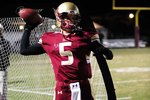 WESTLAKE VILLAGE, CA - OCTOBER 30: Nick Montana #5 of Oaks Christian warms up his arm before the second half against Oak Park on October 30, 2009 in Westlake Village, California.  (Photo by Jacob de Golish/Getty Images)