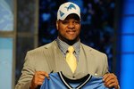 NEW YORK - APRIL 22:  Ndamukong Suh from the Nebraska Cornhuskers holds up a Detroit Lions jersey after Suh was selected by the Lions number 2 overall during the first round of the 2010 NFL Draft at Radio City Music Hall on April 22, 2010 in New York City.  (Photo by Jeff Zelevansky/Getty Images)