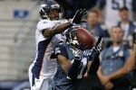 SEATTLE - AUGUST 22:  Wide receiver Deon Butler #11 of the Seattle Seahawks halls in a touchdown catch against Andre Goodman #21 of the Denver Broncos on August 22, 2009 at Qwest Field in Seattle, Washington. (Photo by Otto Greule Jr/Getty Images)