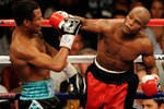 LAS VEGAS - MAY 01:  (R-L) Floyd Mayweather Jr. throws a right to the head of Shane Mosley during the welterweight fight at the MGM Grand Garden Arena on May 1, 2010 in Las Vegas, Nevada.  (Photo by Ethan Miller/Getty Images)