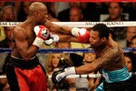 LAS VEGAS - MAY 01:  (L-R) Floyd Mayweather Jr. throws a left to the face of Shane Mosley fight during the welterweight fight at the MGM Grand Garden Arena on May 1, 2010 in Las Vegas, Nevada.  (Photo by Ethan Miller/Getty Images)