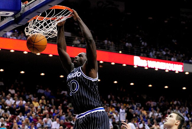 ORLANDO, FL - DECEMBER 02:  Brandon Bass #30 of the Orlando Magic scores over Danilo Gallinari #8 of the New York Knicks during the game at Amway Arena on December 2, 2009 in Orlando, Florida.  NOTE TO USER: User expressly acknowledges and agrees that, by downloading and/or using this Photograph, user is consenting to the terms and conditions of the Getty Images License Agreement.  (Photo by Sam Greenwood/Getty Images)