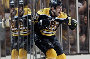 BOSTON - MAY 01:  Marc Savard #91 of the Boston Bruins celebrates his game winning goal in the overtime period against the Philadelphia Flyers in Game One of the Eastern Conference Semifinals during the 2010 NHL Stanley Cup Playoffs at TD Garden on May 1, 2010 in Boston, Massachusetts. The Bruins defeated the Flyers 5-4 in overtime.  (Photo by Elsa/Getty Images)