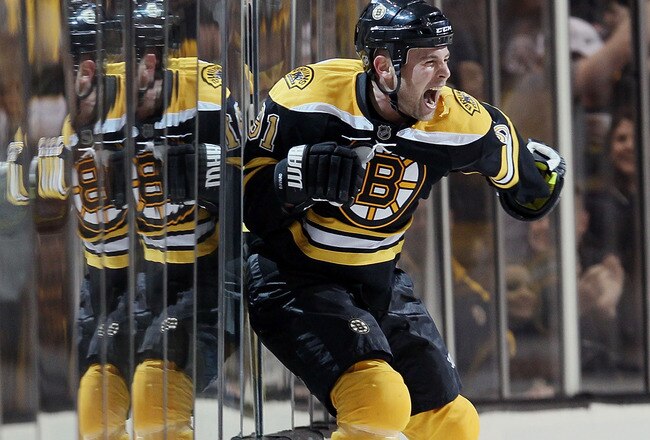 BOSTON - MAY 01:  Marc Savard #91 of the Boston Bruins celebrates his game winning goal in the overtime period against the Philadelphia Flyers in Game One of the Eastern Conference Semifinals during the 2010 NHL Stanley Cup Playoffs at TD Garden on May 1, 2010 in Boston, Massachusetts. The Bruins defeated the Flyers 5-4 in overtime.  (Photo by Elsa/Getty Images)