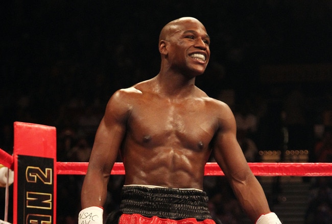 LAS VEGAS - MAY 01:  Floyd Mayweather Jr. smiles from his corner during a round break during his fight against Shane Mosley during the welterweight fight at the MGM Grand Garden Arena on May 1, 2010 in Las Vegas, Nevada.  (Photo by Jed Jacobsohn/Getty Images)