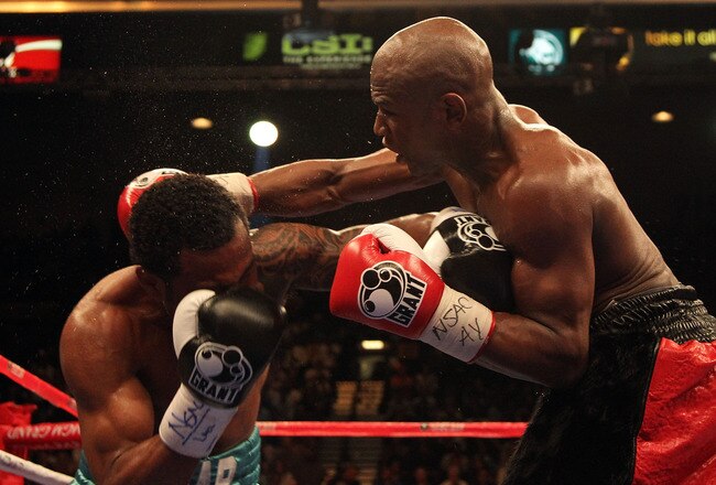 LAS VEGAS - MAY 01:  (R-L) Floyd Mayweather Jr. throws a right to the head of Shane Mosley during the welterweight fight at the MGM Grand Garden Arena on May 1, 2010 in Las Vegas, Nevada.  (Photo by Jed Jacobsohn/Getty Images)
