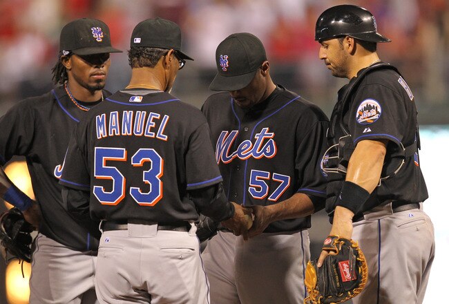 PHILADELPHIA - MAY 2: Manager Charlie Manuel #53 takes the ball from starting pitcher Johan Santana #57 during a game against the Philadelphia Phillies at Citizens Bank Park on May 2, 2010 in Philadelphia, Pennsylvania. (Photo by Hunter Martin/Getty Images)