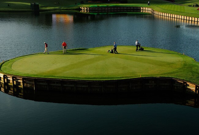 PONTE VEDRA BEACH, FL - MAY 03:  The grounds crew prepares the 17th hole prior to a practice round for THE PLAYERS at TPC Sawgrass on May 3, 2010 in Ponte Vedra Beach, Florida.  (Photo by Sam Greenwood/Getty Images)