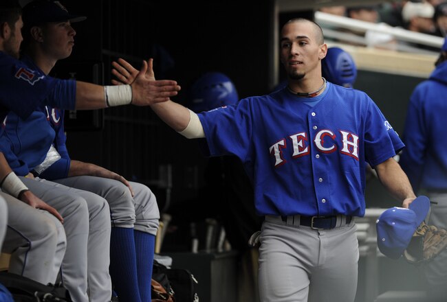 MINNESOTA, MN - MARCH 27: Taylor Terrasas #7 of the Louisiana Tech Bulldogs celebrates scoring in the dugout in the eighth inning against the Minnesota Golden Gophers during an exhibition game at Target Field on March 27, 2010 in Minneapolis, Minnesota. Bulldogs defeated the Gophers 9-1. (Photo by Hannah Foslien /Getty Images)