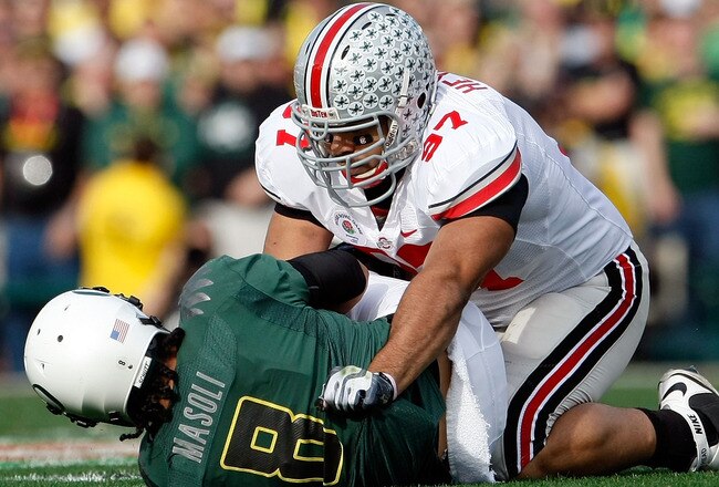 PASADENA, CA - JANUARY 01:  Defensive lineman Cameron Heyward #97 of the Ohio State Buckeyes sacks quarterback Jeremiah Masoli #8 of the Oregon Ducks during the 96th Rose Bowl game on January 1, 2010 in Pasadena, California.  (Photo by Jeff Gross/Getty Images)