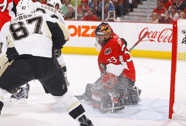 OTTAWA, ON - APRIL 24:  Pascal Leclaire #33 of the Ottawa Senators makes a save down low with Sidney Crosby #87 of the Pittsburgh Penguins looking for a rebound at the side of the crease during Game 6 of the Eastern Conference Quaterfinals during the 2010 Stanley Cup Finals at Scotiabank Place on April 24, 2010 in Ottawa, Canada. The Ottawa Senators lead the Pittsburgh Penguins 1-0 after one period. (Photo by Phillip MacCallum/Getty Images)