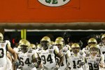 MIAMI GARDENS, FL - JANUARY 05:  The Georgia Tech Yellow Jackets take the field to play against the Iowa Hawkeyes during the FedEx Orange Bowl at Land Shark Stadium on January 5, 2010 in Miami Gardens, Florida.  (Photo by Doug Benc/Getty Images)