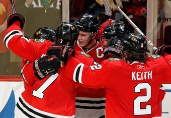 CHICAGO - APRIL 24: (L-R) Patrick Kane #88, Brent Seabrook #7, Jonathan Toews #19, Patrick Sharp #10 and Duncan Keith #2 of the Chicago Blackhawks celebrate a goal by Kane with 13 seconds left in regulation time against the Nashville Predators in Game Five of the Western Conference Quarterfinals during the 2010 NHL Stanley Cup Playoffs at the United Center on April 24, 2010 in Chicago, Illinois. The Blackhawks defeated the Predators 5-4 in overtime. (Photo by Jonathan Daniel/Getty Images)