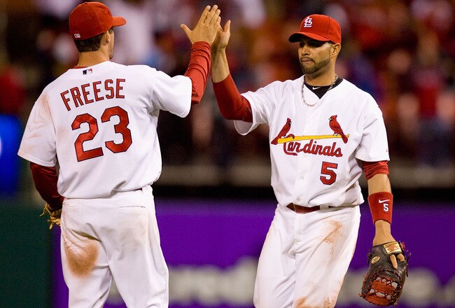 ST. LOUIS - APRIL 26: Albert Pujols #5 and David Freese #23 both of the St. Louis Cardinals celebrate beating the Atlanta Braves at Busch Stadium on April 26, 2010 in St. Louis, Missouri.  The Cardinals beat the Braves 4-3.  (Photo by Dilip Vishwanat/Getty Images)