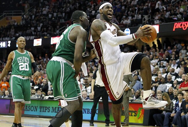 CLEVELAND - MAY 03:  LeBron James #23 of the Cleveland Cavaliers tries to get a shot off around Kendrick Perkins #43 of the Boston Celtics during Game Two of the Eastern Conference Semifinals during the 2010 NBA Playoffs at Quicken Loans Arena on May 3, 2010 in Cleveland, Ohio. Boston won the game 104-86 to tie the series 1-1. NOTE TO USER: User expressly acknowledges and agrees that, by downloading and or using this photograph, User is consenting to the terms and conditions of the Getty Images License Agreement.  (Photo by Gregory Shamus/Getty Images)