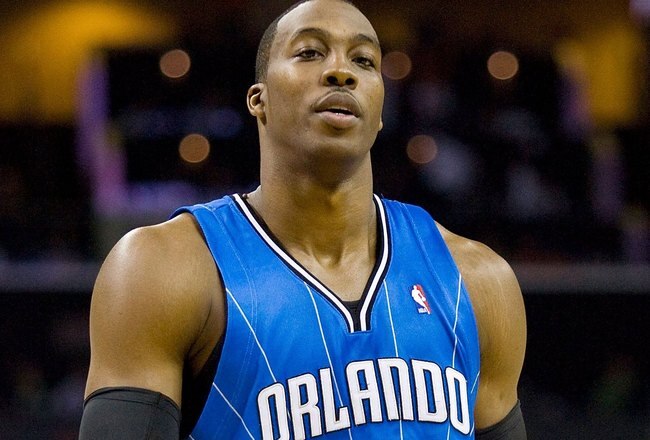 CHARLOTTE, NC - APRIL 26: Dwight Howard #12 of the Orlando Magic at Time Warner Cable Arena on April 26, 2010 in Charlotte, North Carolina.  The Magic defeated the Bobcats 99-90 to complete the four game sweep.  NOTE TO USER: User expressly acknowledges and agrees that, by downloading and or using this Photograph, user is consenting to the terms and conditions of the Getty Images License Agreement.   (Photo by Brian A. Westerholt/Getty Images)