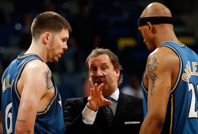 NEW ORLEANS - MARCH 31:  Mike Miller #6, head coach Flip Saunders and James Singleton #22 of the Washington Wizards talk during a timeout against the New Orleans Hornets at New Orleans Arena on March 31, 2010 in New Orleans, Louisiana.  The Wizards defeated the Hornets 96-91.  NOTE TO USER: User expressly acknowledges and agrees that, by downloading and/or using this Photograph, User is consenting to the terms and conditions of the Getty Images License Agreement.  (Photo by Chris Graythen/Getty Images)