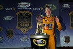 RICHMOND, VA - MAY 01:  Kyle Busch, driver of the #18 M&M's Toyota, celebrates with the trophy in victory lane after winning the NASCAR Sprint Cup Series Crown Royal Presents the Heath Calhoun 400 at Richmond International Raceway on May 1, 2010, 2010 in Richmond, Virginia.  (Photo by Chris Trotman/Getty Images)