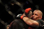 NEWARK, NJ - MARCH 27:  UFC fighter Georges St-Pierre (R) celebrates his win over Dan Hardy during their Welterweight title bout at UFC 111 at the Prudential Center on March 27, 2010 in Newark, New Jersey.  St-Pierre won by Unanimous Decision at 5:00 of the 5th round.  (Photo by Jon Kopaloff/Getty Images)
