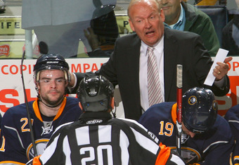 BUFFALO, NY - APRIL 23: Lindy Ruff , head coach of the  Buffalo Sabres talks to referee Tim Peel #20 during a tim out against  the Boston Bruins in Game Five of the Eastern Conference Quarterfinals  during the 2010 NHL Stanley Cup Playoffs at HSBC Arena on April 23, 2010   in Buffalo, New York.  (Photo by Rick Stewart/Getty Images)