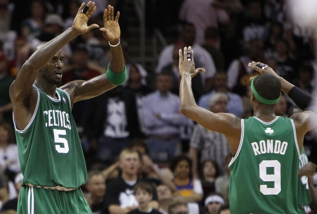CLEVELAND - MAY 03:  Kevin Garnett #5 of the Boston Celtics celebrates with Rajon Rondo #9 of the while playing the Cleveland Cavaliers in Game Two of the Eastern Conference Semifinals during the 2010 NBA Playoffs at Quicken Loans Arena on May 3, 2010 in Cleveland, Ohio. Boston won the game 104-86 to tie the series 1-1. NOTE TO USER: User expressly acknowledges and agrees that, by downloading and or using this photograph, User is consenting to the terms and conditions of the Getty Images License Agreement.  (Photo by Gregory Shamus/Getty Images)