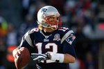 FOXBORO, MA - JANUARY 10:  Tom Brady #12 of the New England Patriots looks to pass against the Baltimore Ravens during the 2010 AFC wild-card playoff game at Gillette Stadium on January 10, 2010 in Foxboro, Massachusetts. The Ravens won 33-14. (Photo by Elsa/Getty Images)