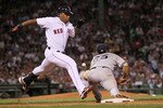 BOSTON - APRIL 07:  Adrian Beltre #29 of the Boston Red Sox beats the throw to Mark Teixeira #25 of the New York Yankees at Fenway Park on April 7, 2010 in Boston, Massachusetts. (Photo by Jim Rogash/Getty Images)