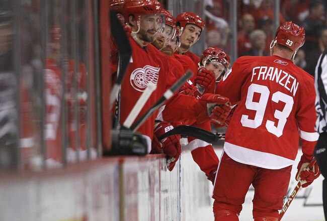 DETROIT - MAY 06: Johan Franzen #93 of the Detroit Red Wings celebrates with the bench after his third period and fourth goal of the game while playing the San Jose Sharks in Game Four of the Western Conference Semifinals of the 2010 NHL Stanley Cup Playoffs on May 6, 2010 at Joe Louis Arena in Detroit, Michigan.  (Photo by Gregory Shamus/Getty Images)
