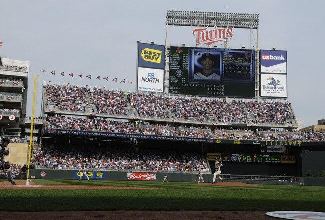 MINNESOTA, MN - APRIL 12: Carl Pavano #48 of the Minnesota Twins throws the first pitch in the first inning against Marco Scutaro #16 of the Boston Red Sox during the Twins home opener at Target Field on April 12, 2010 in Minneapolis, Minnesota. (Photo by Hannah Foslien /Getty Images)